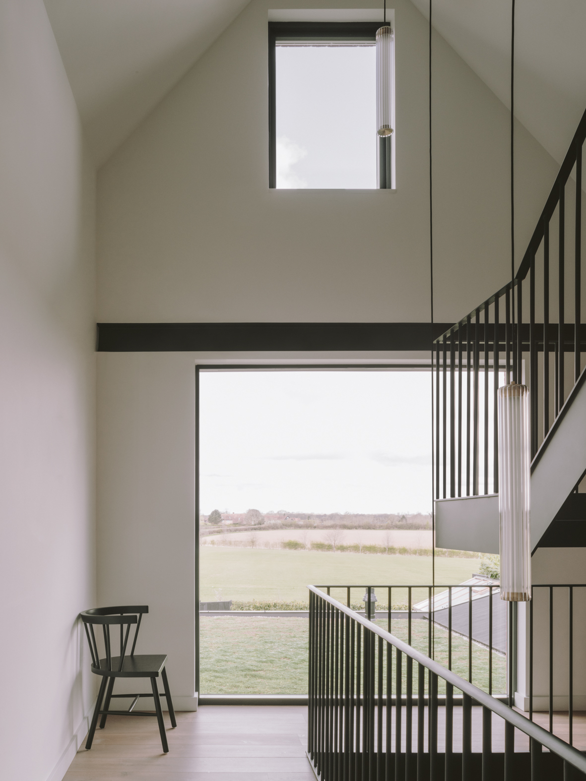 The partially suspended steel staircase at Chelwood with its views over the rural landscape.